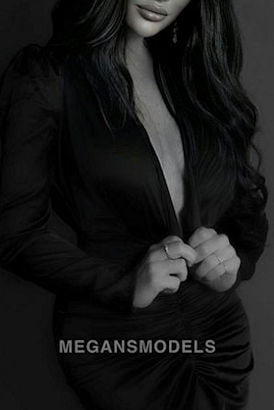 Stylish Middle Eastern girl in a hlaf opened black jacket