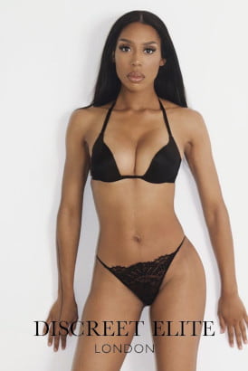 Slender black girl in a black bikini